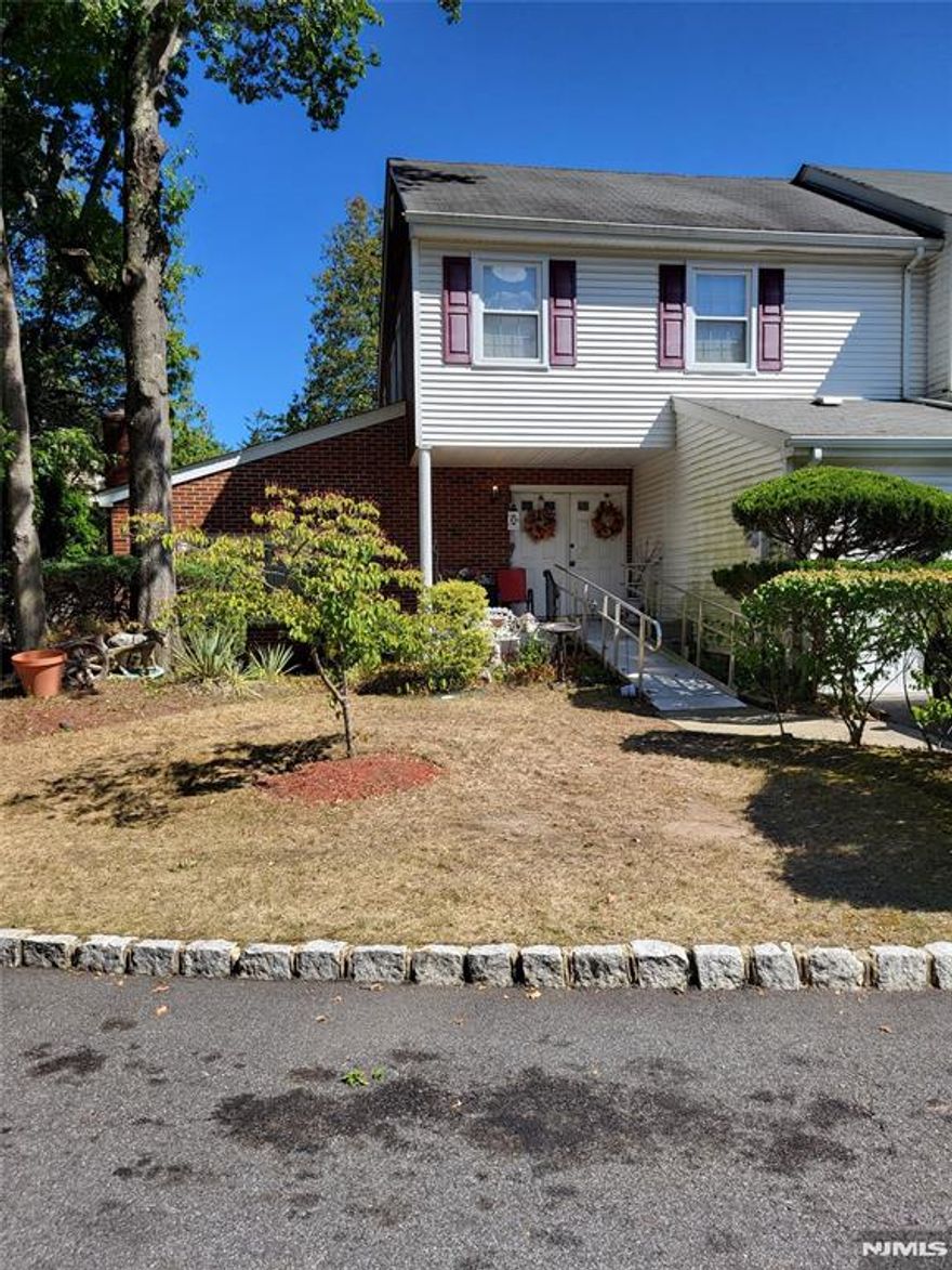 This is an "As Is" Estate Sale. It is a diamond in the rough that needs some TLC. It is currently wheel chair accessible with a ramp leading to the front entrance and chair lifts to the 2nd level. An extra wide entrance to the main bath and walk-in shower were added as well. This townhome offers 3 spacious bedrooms, 2 and 1 half baths, a finished basement with a nice size office, and a 1 car oversized garage. Greet guests in the entrance foyer which leads to a sunken living room with a gas log fireplace and sliding door entrance to your own private patio. The same main level also includes a formal dining room, and a large eat-in country kitchen and laundry room area. The basement level is fully finished and also contains a nice size office. The primary bedroom features 2 walk-in closets and a dressing area outside the toilet and bath/shower area. NYC transportation at the main entrance. School busses for all grades come into the development. Indoor tennis, a high end pool, athletic field and playground are also part of this development. Come check it out and make an offer.