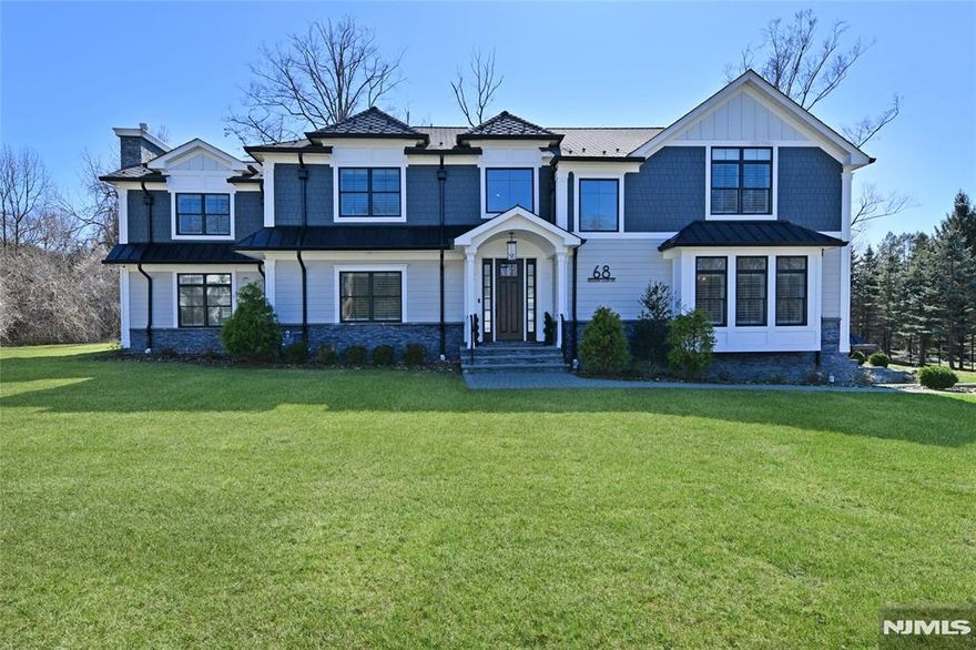 Gorgeous and elegant 4 yrs young Center Hall Colonial comes with smart home features and 5200+ sqft of lovely living space in prime East Hill location!! Have it all with Lifetime dimensional roof, James Hardi siding and beautiful cultured stone. The stunningly designed interior has 5 BR & 5 Bth, custom millwork throughout, and premium oak hardwood floors. The gourmet kitchen w/ custom cabinets, countertops, and high end appliances opens up to dining area & large family room w/ gas fireplace and wetbar. En suite on first floor w/ fireplace and fbth, banquet sized DR, office, and formal LR. 2nd floor offers MBR, 2 WICs, fireplace, MBTH w/ dbl sinks, tub, shower stall. Junior suite w/ FBTH, 2 large BR/s, hall Bth, oversized laundry room. The basement is finished, 5th FBTH, EV ready. The perfect yard offers a large deck and plenty of room for a pool. Call listing agent 917-409-7336. A true haven of impeccable style! Great schools in an amazing neighborhood! Owner holds real estate license.