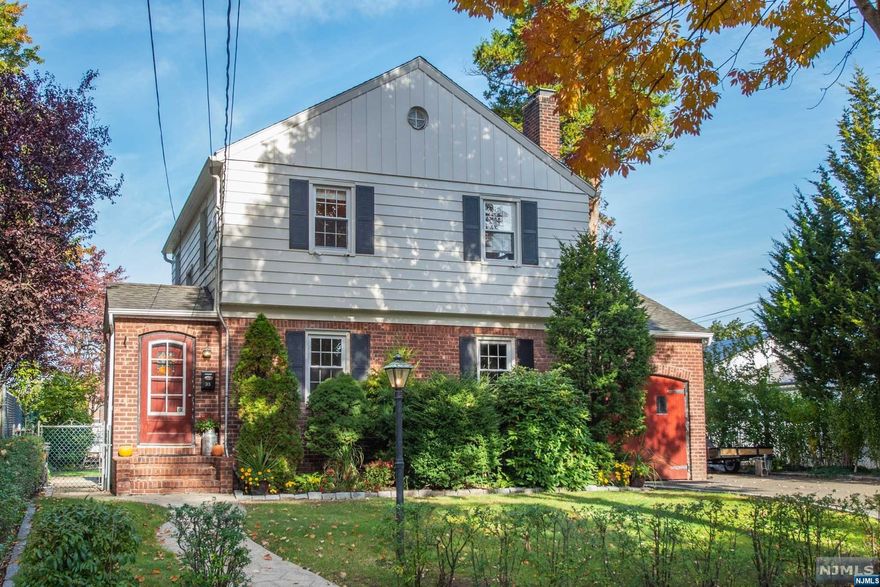 While located on a quiet street you are just minutes away from great restaurants, shopping, parks and NYC transportation. This spacious colonial offers hardwood floors throughout, a large living room with wood burning fireplace with insert and a formal dining room. The eat-in kitchen has plenty of cabinets and access to the fenced in backyard. On the second level are 3 bedrooms and the main bath. The fully finished basement provides extra living space in the large family room, full bath and laundry room with sink. Enjoy the outdoors having your morning coffee on the patio or tending to your home garden.