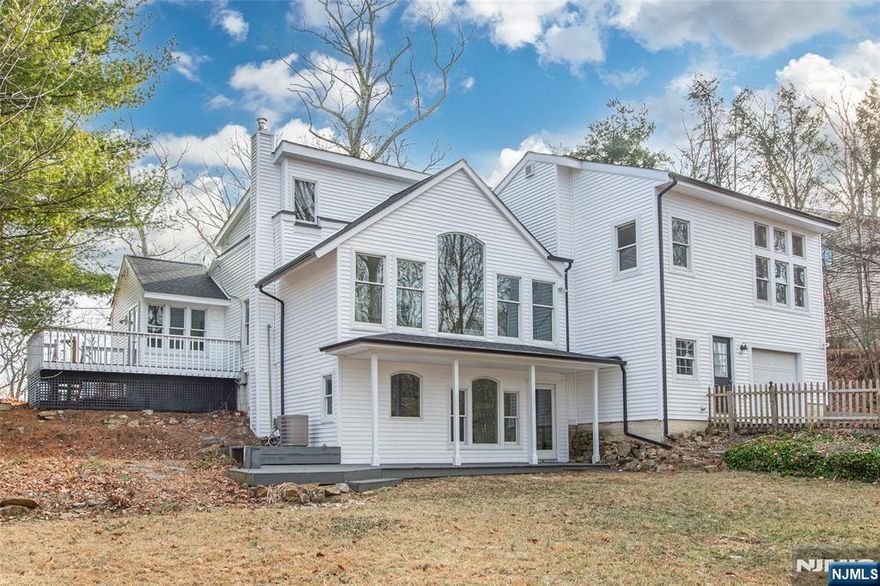 Brand-new Modern Farmhouse renovation on a tranquil private setting lifestyle in Boonton Township. Expanded custom designed to incorporate extended spacious living with 3 bedrooms, each with its own private full bathrooms, includes a Primary Suite with its own private sitting room area, master bath has double sink quartz vanity, large standing shower, and nice walk-in closet space. Additional Bonus room offers many opportunities for private office with bathroom and separate staircase. Indulge in your new kitchen with quartz countertops, SS appliances, beautiful soft-close cabinets, lighted by a fabulous farmhouse chandelier and natural light from huge panoramic Anderson windows that bring nature scenic views indoors, and high cathedral ceilings. Charming Living Room with wood burning fireplace is not the only relaxing space, enjoy the ground level family room with walkout access to the backyard. Newly finished hardwood floors throughout, and newly carpeted bedrooms. Other renovations include a brand-new roof, new siding all with warranties. Newly painted with specialty moldings. Neighborhood offers community activities -inground pool, pavilion with recreational river access. Natural gas in the street if preferred. Come for a visit, is close to NYC, transportation, schools, parks, and shopping. Plenty of parking in the long driveway and has a 2-car garage. Your new home awaits you!