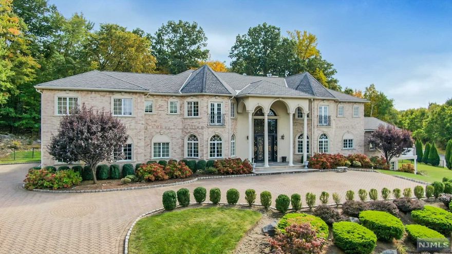 SPECTACULAR, CUSTOM BUILT BRICK ESTATE ON OVER 1 ACRE. CORNER LOT HIGH ON HILL WITH SWEEPING VIEWS OF THE WESTERN MOUNTAINS. DRAMATIC ENTRANCE WITH DOME CEILING AND MARBLE FLOORS - HUGE FLOOR TO CEILING WINDOWS IN GREAT ROOM WITH FIREPLACE. BREATHTAKING MAIN LEVEL MASTER BEDROOM SUITE WITH SITTING ROOM AND BALCONY WITH STUPENDOUS VIEWS. HOME THEATER ON SECOND FLOOR. SWIMMING POOL & SPA WITH WATERFALL. A HOUSE TO TREASURE!