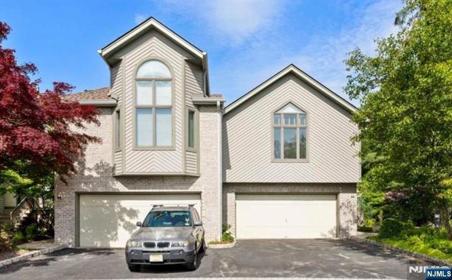 Location! Location! Location! The Crown Jewel of Northwoods: Rare opportunity to own Unrivaled Luxury & Privacy, Surrounded by nature and unparalleled privacy, this luxury, spacious & abundant natural light filled 4BR, 3.5Bth end unit home boasts ample living space in the coveted Northwoods. The 1st floor opens into modern eat-in kitchen and formal Dining room has access to private deck, perfect for relaxing and outdoor gatherings. Spacious great room features 2 story vaulted ceiling, skylights and dual fireplace. The private primary Bedroom is on the mezzanine floor showcasing cathedral ceiling, En-suite Bath with whirlpool and separate shower. Two large Bedrooms and full bath & laundry complete the 2nd floor. Full, finished basement includes very spacious rec room/ home office, Bedroom and dual full bath. Wide hardwood floors, New roof, Updated 4 zone HWBB & C/A, C/V, 2 car attached garage. Tennis courts, swimming pool, gym, club house and playground are included amenities for the residents of this prestigious community. Enjoy resort-style living. Truly extraordinary!