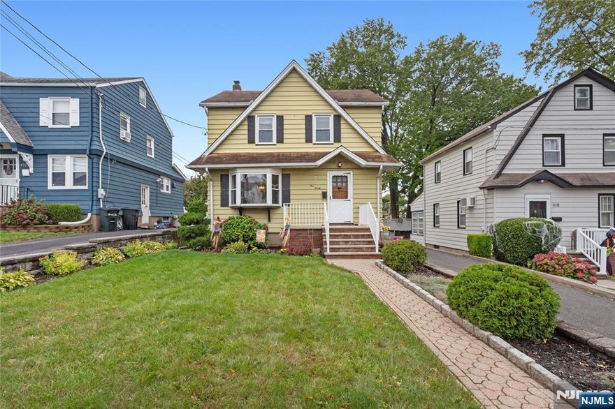 Welcome to 420 Innes Road; a 3-bedroom Colonial on one of Wood Ridge's most sought-after streets; just steps to NY transportation, Valley Boulevard's shops, parks & fabulous, multi-cultural restaurants. This well-maintained charmer, with its incredibly LOW taxes, is the perfect entry level home in a much-desired town. The spacious 1st level features living room, formal dining room & eat-in kitchen with breakfast area overlooking the yard. 3 bedrooms & tiled bath can be found on the 2nd floor with Bessler stairs to attic storage. Extra space can be found in the part finished basement with rec room, laundry area & 1/4 bath. Situated on a 40x125 property with an oversized one car garage and multi-car driveway, the bonus deep yard is ideal for the gardening enthusiast and the perfect place for outdoor relaxation! The newer (2020) boiler, replacement windows, and maintenance free exterior are just a few of the features which make this home the perfect place to bring your decorating ideas, personal touches and cosmetic updates to make this lovely home your own! Hurry will not last!!!