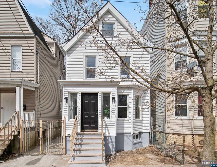 Welcome Home! Introducing a fully renovated 5 Bedroom home with a finished attic and a potential in-law suite. This charming residence offers modern elegance and functionality. The main floor boasts a gourmet kitchen with stainless steel appliances and stunning quartz countertops throughout. Upstairs a primary suite, along with two additional bedrooms including a finished attic. The lower level provides more living space laundry facilities and a potential in-law suite or guest quarters with a separate entrance. Central Air and tankless water heater as well on site laundry facility complete this home Outside, new concrete driveway and the large backyard oasis perfect for entertaining. With its convenient location and luxurious finishes, this home is ready to welcome you.