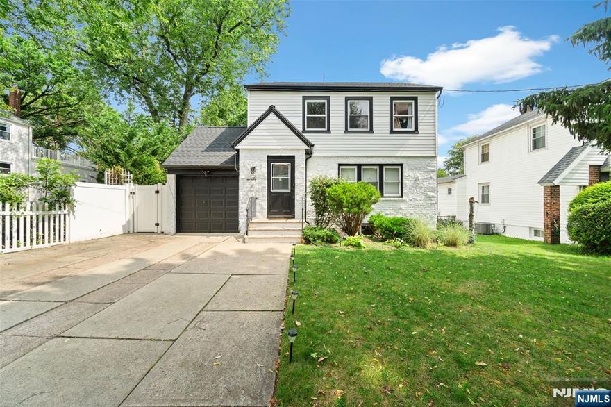 Welcome to 49 Walnut Street! A beautifully updated colonial where modern luxury meets classic charm. This spacious 3-bedroom, 2-bathroom home features a bright and airy open-concept layout, flowing seamlessly from the living room to the dining area-perfect for entertaining or everyday living. The brand-new kitchen is the heart of the home, complete with a center island, custom coffee bar, and sleek finishes that elevate the space. Natural light floods in through oversized windows, accentuating the rich hardwood floors throughout. A sunny enclosed porch/sunroom offers the perfect retreat for morning coffee or evening wind-downs. Enjoy peace of mind with a brand-new roof, upgraded 200-amp electrical service, and a Level 2 EV charging station-ideal for todayâ€™s eco-conscious lifestyle. The attached garage, long driveway, and private fenced yard provide convenience, curb appeal, and room to grow. Located on a quiet, tree-lined block in a desirable neighborhood-and just minutes from NYC transit-this Teaneck home truly checks every box for comfort, style, and modern living.