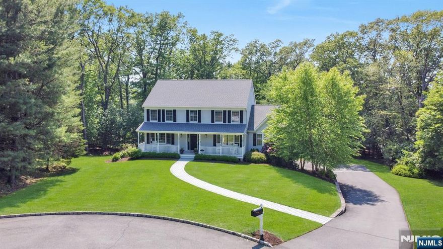 Impressive Custom-Built Colonial in Prime Dogwood Elementary Neighborhood! Nestled on a premiere cul-de-sac, less than a mile from Valley MS and Indian Hills HS. Spanning over 3,000 sqft on more than an acre, it offers functional elegance with thoughtful design throughout. Gleaming hardwood floors, oversized windows, an inviting front porch, gracious staircase with entry foyer create a warm welcome. The stunning great room boasts a soaring ceiling and fireplace, flowing into an oversized gourmet kitchen with 6ft sliding glass doors to a Trex deckâ€”perfect for outdoor enjoyment. A sought-after first-floor bedroom with full bath, plus extra rooms for office space, add versatility. Upstairs, the primary suite features a spa bath, walk-in closet, and private deck, accompanied by three additional bedrooms and a full bath. The finished walk-out basement is an entertainerâ€™s dream with surround sound, a gym, wine room, laundry, half bath, and ample storage. Outside, enjoy a regulation basketball court with a 3-point shooting zone. Complete with a whole-house generator, 2020 roof, tankless water heater, and 2-car attached garageâ€”this home is the complete package!