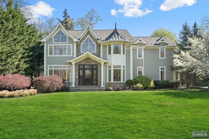 When an immaculate interior, lovely setting and prime location top your list, look no further than this center hall Colonial. Resting on over a quarter of an acre of beautifully landscaped property, curb appeal is only the beginning. Inside, you are greeted by an open-concept main living area w/gleaming hardwood floors and gorgeous millwork throughout. As the foyer spills into the dining room and living room, the sparkling modern kitchen beyond includes sliders to the patio and backyard. The kitchen offers a generous center island breakfast bar with a built-in dishwasher and two refrigerated drawers, Sub-Zero refrigerator, Viking cooktop, wall oven and microwave, an additional dishwasher, as well as plenty of cabinet and counter space. The main level also includes a convenient home office and powder room. Four bedrooms, including the spacious primary suite, are comfortably nestled on the 2nd floor.