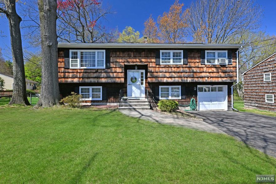 Wonderful Extended family home lovingly cared for and situated on an amazing and spacious property awaits it's new owner. This large Bi-level home features hardwood floors,plenty of closet space and a wonderful canvas to make this your own.This home features two kitchens,living rooms,and multiple bedrooms.(please note garage has been converted to one of the two bedrooms downstairs). Close to schools, parks, highways and transportation and the ability to share this home with family members makes this home very special.