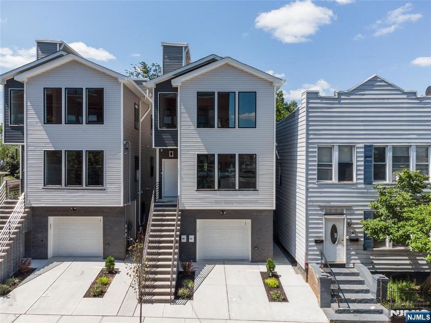 Be the next owner of this gorgeous 6 bed 5 bath 2-family home located 25 minutes outside of NYC! Recently constructed in 2021, this home is equipped with hardwood floors throughout, quartz countertops in each unit kitchen, stainless steel appliances, washer dryer in both units, and a rooftop terrace with NYC views! Unit 1 features 3 bedrooms, 2 baths on the first floor with a bonus recreational room and half bath on the lower level. Unit 2 features 3 beds 2 baths. Plenty of shops and restaurants close by. Do not miss out on this perfect opportunity !