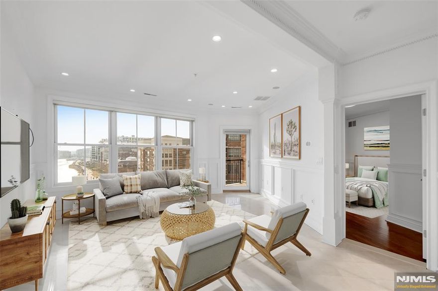 World-class living awaits you in this stunning 2 Bedroom + Den / 2 Bathroom luxury home located in highly sought after Grandview I. Situated along the banks of the Hudson River and just steps from restaurants & shopping, this home features only the finest finishes. Stretching across 1,328 SqFt, this sun drenched home features direct South and East views of NYC and the Hudson River, gleaming floors, custom window treatments, custom molding and woodwork, one car garage parking, in-unit laundry, and balcony with stunning views. This corner unit floor plan includes entry foyer, living room / dining room combo, Chef's kitchen, two spacious bedrooms, renovated bathrooms, and bonus den / office. Chef's kitchen includes granite countertops, custom cabinets, SS appliances, and breakfast bar. Master bedroom features custom walk-in closet and renovated ensuite bathroom with dual vanity and linen closet. Grandview I includes 24 hour concierge, fitness center, resident lounge, outdoor pool with NYC views, and a pilot tax abatement program. Located next to ample shopping, restaurants, public transportation, and the waterfront walkway, this home is sure to please!