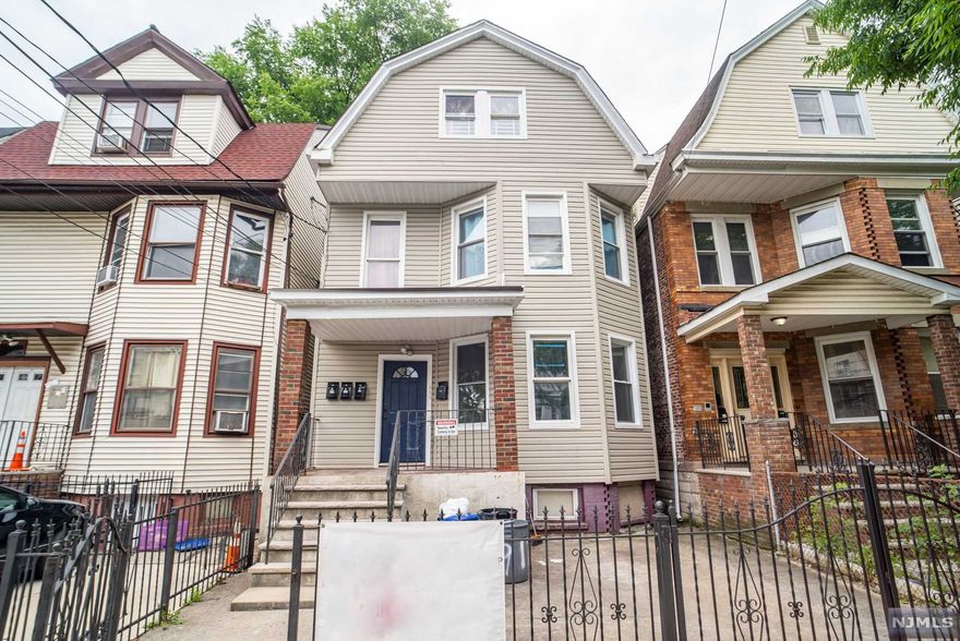 THE DEAL OF THE YEAR HAS ARRIVED!! This massive LEGAL three unit CASH FLOW property with performing tenants and first floor VACANT. This is a dream come true for those who've been looking for a long term investment or to live in one unit and rent the others. FORCED HOT AIR, OFF STREET PARKING AND CENTRAL AIR! Well maintained, large rooms, PRIME location. Come turn this house into your home before someone else does.