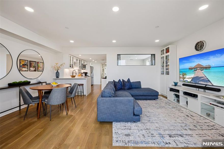 With bright northeast exposure and NYC skyline views, this fully renovated two-bedroom at Zephyr Lofts offers turnkey, elevated living on the Hobokenâ€“Jersey City border. Minutes from the Hoboken PATH, the location is ideal for commuters and city lovers alike. The sophisticated open layout features an upgraded kitchen with white shaker cabinetry, premium stainless-steel appliances, and white quartz countertops with a waterfall island. Hardwood floors run throughout, and a brand-new HVAC system ensures year-round comfort. Both bedrooms are well-sized with great closets and abundant natural light. Additional highlights include a full-size washer/dryer and a spa-inspired bathroom with double vanity and a modern tub/shower. Zephyr Lofts amenities include 24/7 concierge and security, a fitness center, and a large private courtyard with BBQs, picnic areas, dog run, and bike racks. Butterfly MX entry adds convenience, and on-site parking is available for a fee. Perfectly positioned near top restaurants, cafés, boutiques, parks, and multiple transit optionsâ€”including PATH, NY Waterway Ferry, and the Holland Tunnelâ€”this renovated home blends luxury, location, and striking skyline views.