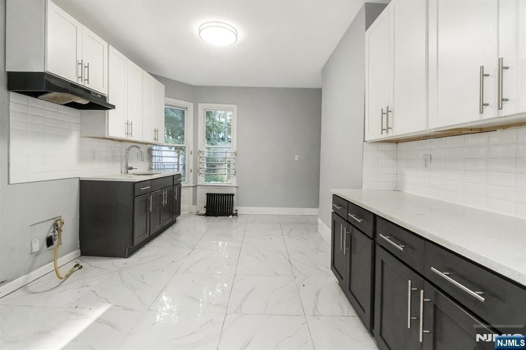 Photo of 65 Grove Street, East Orange, NJ 07017 (MLS # 25038490)