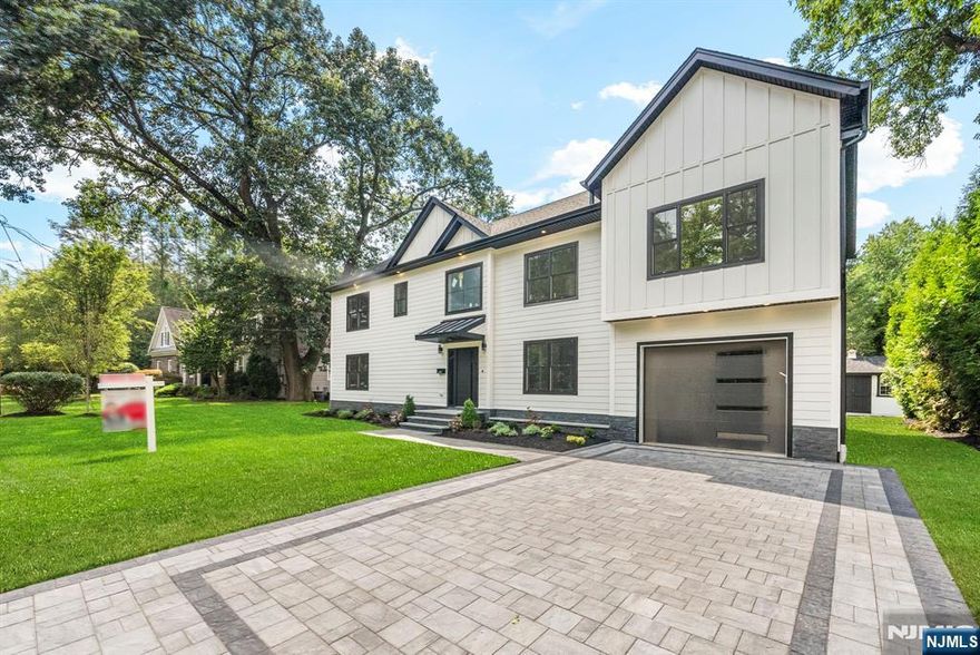 Welcome to 403 12th Street, Cresskill, NJ! This exceptional new construction, built on an existing foundation, offers the perfect combination of modern elegance and timeless design with 5 spacious bedrooms, 5 designer bathrooms, and a fully finished basement. The first floor showcases a dramatic two-story foyer, a gourmet chefâ€™s kitchen with custom cabinetry, center island, and walk-in pantry, an expansive living room with soaring ceilings and a statement fireplace, and a formal dining area with sliding doors leading to a private patioâ€”ideal for entertaining. Two versatile bedrooms with a full bath complete the main level, offering flexibility for guests, office, or multi-generational living. The second floor boasts a lavish primary suite with a spa-inspired bath and oversized walk-in closet, two additional en-suite bedrooms with walk-in closets, and a convenient laundry room. The lower level is fully finished with a spacious recreation area, full bath, and a private room perfect for a home theater, gym, or office. Perfectly situated in the prestigious town of Cresskill, this residence offers top-rated schools, close proximity to shopping and dining, and an effortless commute to New York Cityâ€”all within a quiet, desirable neighborhood