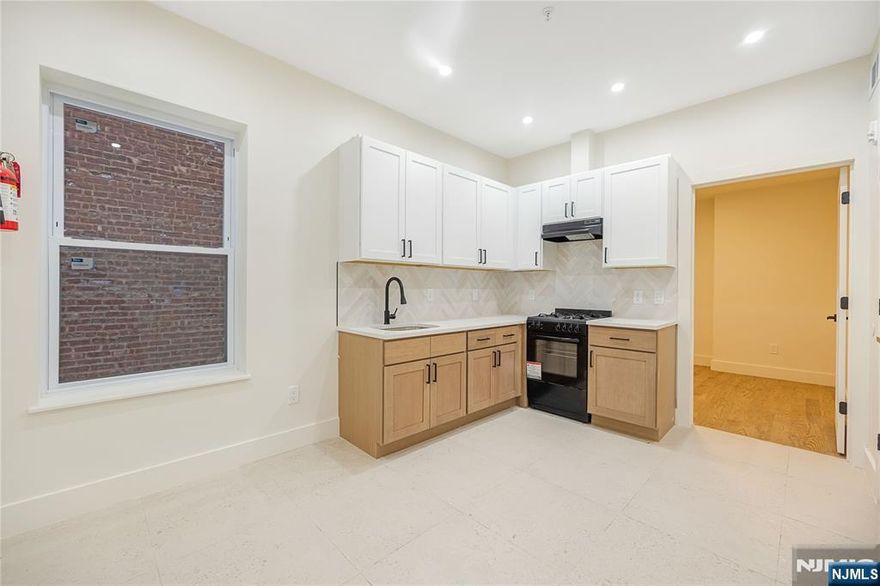 Spacious living in this 1 bedroom, 1 bath unit located on the first floor of a newly renovated 9 unit building. The open layout features a modern kitchen with stainless steel appliances, gas range, and dishwasher. The bedroom offers a walk-in closet and private en suite bath. Residents enjoy access to basement laundry. Ready for immediate occupancy. Credit check, proof of income, and ID required. Pets are conditional with an additional fee. Ideally located in a desirable, commuter-friendly area close to shopping, dining, and transportation.