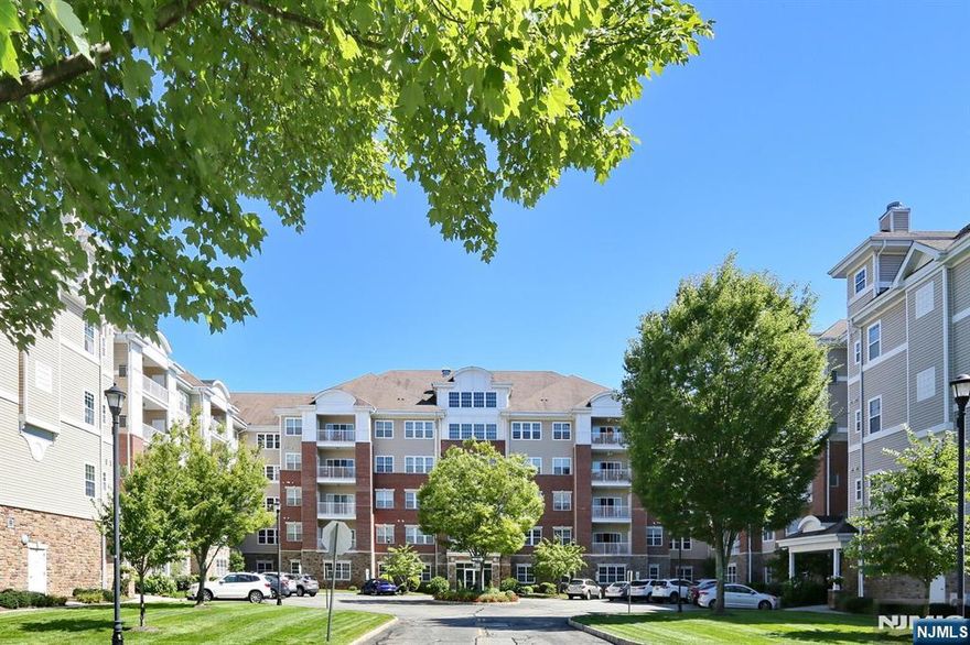 Brand new heating & air conditioning system, new windows, eat-in-kitchen updated with cherry cabinets, granite counters and stainless steel appliances. This wonderful 1768 SF 3rd floor Colfax unit in Wanaque Reserve, a Del Webb active adult 55+ community, is move-in ready. One of the first things you notice are the gleaming hardwood floors. The home features a primary bedroom ensuite with full bath, tray ceiling and WIC, 2nd bedroom, FB, LR, DR and den/home office with French doors. The LR sliding doors open to a sunny, private balcony. Amenities include a deeded underground parking spot and 24-hour security. The 20,000 SF clubhouse has a cafe, ballroom, exercise room, theater, sauna, indoor and outdoor pools and more than 45 clubs and activities, which include the travel club (cruises, day trips, casino trips) tennis, pickleball, canasta, poker, golf, etc. This building is close to the clubhouse. Wanaque Reserve offers a luxurious lifestyle for its residents with a focus on modern amenities, security and a sense of community. The recent renovation adds a fresh and updated living environment.