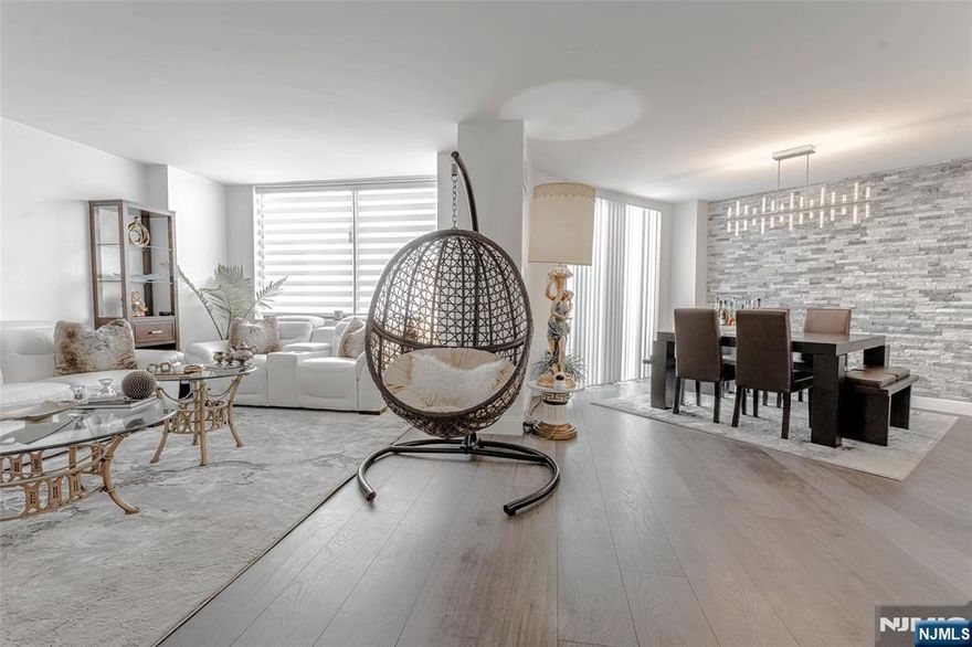 Experience luxury redefined in this stunning 1,842 sq. ft. duplex w/ spacious 3 Bdrms 2.5 Bthrms + Loft area at Harmon Cove Towers. Meticulously renovated, this contemporary residence blends sophisticated design w/ premium mtrls. The open-concept main floor features living & dining area, stunning half bathrm, wet bar, & a chefâ€™s kitchen boasting breakfast bar, custom soft-close cabinets, quartz countertops, designer SS backsplash, SS appliances & farm sink. Open dining area w/ glass sliders lead to a terrace w/ spectacular sunset views over the Hackensack river! Upper level features a versatile loft- perfect for a home office/Kids play area. High-end Master bedrm suite, w/ custom Walk-in closet & Master bthrm w/ a customized floating vanity & a terrace. &2nd b drm has a 2nd full bath attached w/ a floating vanity. Main floor Bedrm ideal for older parents Water-resistant laminate wood floors, custom blinds throughout, new light fixtures, & no popcorn ceiling (living/ dining rm & kitchen). Central A/C, In-Unit Laundry & one parking space Harmon Cove Towers is a beautiful complex w/ resort style amenities incl in HOA- 24 hr concierge, security, pool, kids pool, gym, sauna & steam rm, bike rm, basketball/tennis courts, nursery, Game rm, Dog Park, Play area. Commuter's delight, express NJ transit bus stop under the bldg & proximity to NJ Transit/ Secaucus Junction. Quiet town w/ grt schools, restaurants, parks, town pool, recreation center, stores. Owner is a licensed realtor.