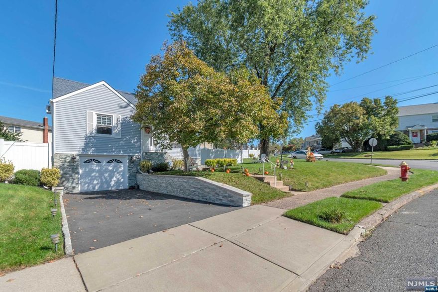 Recently renovated interior and exterior, turn-key Cape-style home situated on a large corner lot with great curb appeal. Additional features include hardwood floors, attached garage, new roof, new central A/C, sprinkler system, stone front, security system and a finished basement with a summer kitchen. Enjoy the very spacious fenced in back yard which consists of four separate entertainment areas. Location is everything, this home places you 20 minutes from the city, with easy access to major highways, great schools and perfect parks. This opportunity is too good to pass up. Your dream home awaits, just pack and move in.