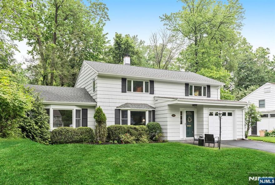 Welcome to your dream home situated on a serene street, perfect for anyone seeking tranquility. This charming Colonial features a spacious open concept Living Room/Dining Room flowing perfectly into the light & bright family room with vaulted ceilings and French doors leading to the paver patio, ideal for gatherings. The eat-in kitchen is both functional and inviting, perfect for casual dining. A powder room, laundry & utilities complete the first floor. With four generous sized bedrooms on the second floor and a full bath with dual vanity & SOT, there's plenty of space for everyone. Private, lush green backyard with patio for summer nights. An attached garage provides convenience and additional storage. Located in the desirable Willard school area or Ridgewood, just around the corner from Irene Habernickel Family Park and close to NJ transportation, don't miss out on this fantastic opportunity!