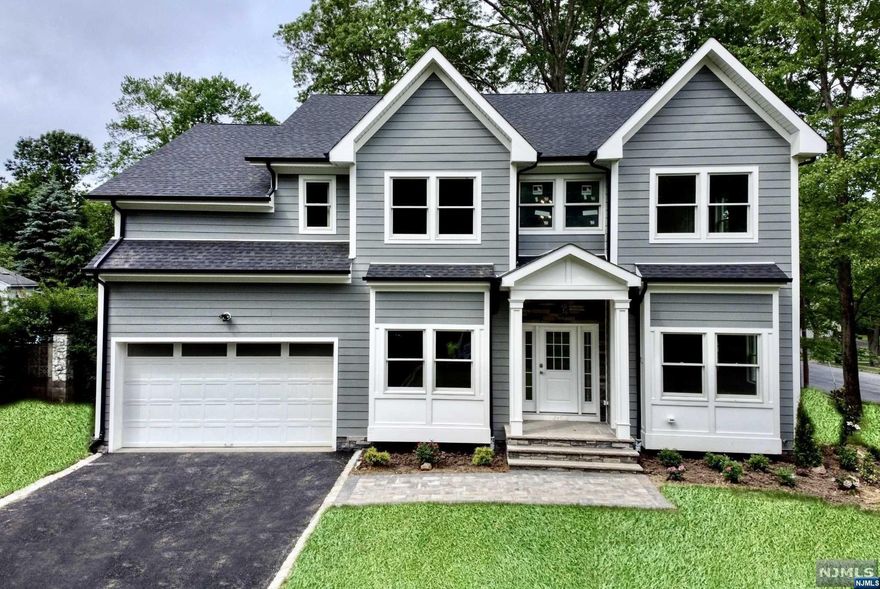 RODAK HOMES NEW CONSTRUCTION in sought after Collins neighborhood! Gorgeous 6 Bed, 5.5 Bath with appx 5,000 sqft of finished living space on 3 floors. Enter the 2 story foyer w sweeping staircase flanked by a formal LR & DR with extensive Millwork. Rich hardwood floors lead to the expansive kitchen & family room with gas fireplace with stone surround; sliders to the deck overlooking the lush backyard. Kitchen is complete with high-end SS appliances, large center island, quartz counters, custom cabinetry & pantry. 1st floor en-suite. The 2nd floor is home to 4 beds with master bedroom designed with a tray ceiling, expansive walk-in closets with custom cabinetry & spa-like bath with soaking tub, stall shower & dual sinks, 2nd bed en-suite; bath & laundry. Finished basement with 9' ft ceilings is equipped with an office/bedroom, media room, rec room with wet bar & full bathroom. 10 YR BUILDER WARRANTY.