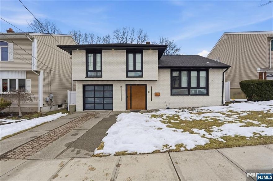 Beautifully renovated single-family home offering 4 bedrooms and 4 full bathrooms in desirable Northend of Secaucus. This move-in ready property features an open-concept living and dining area, perfect for everyday living and entertaining. The eat-in kitchen is equipped with granite countertops, a waterfall island, and brand-new appliances. Brand-new hardwood floors run throughout, along with freshly updated walls and ceilings for a modern, clean feel. The spacious primary bedroom includes a private ensuite bathroom. A fully finished basement provides additional living space, complete with a bedroom and full bathâ€”ideal for guests, extended living, or a home office. Enjoy outdoor gatherings on the full-size deck. Renovated throughout with quality finishes and thoughtful design, this home offers space, style, and versatility in a prime location - right next to Schmidts Wood.