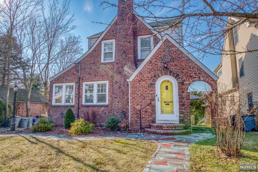 BEAUTIFUL TUDOR COLONIAL BUILT IN 1935 BUT UPDATED THROUGHOUT THE YEARS. FIRST FLOOR OF THIS HOME FEATURES AN ENTRY FOYER, LIVING ROOM, FORMAL DINING ROOM, DEN, HALF BATH WITH SKYLIGHT, EAT-IN KITCHEN WITH SS APPLIANCES & NEW QUARTZ COUNTER TOPS, WOOD BURNING FIREPLACE AND 3 SEASON SUN ROOM. GORGEOUS CHESTNUT WOOD TRIMS ALL AROUND. SECOND FLOOR OFFERS MAIN BEDROOM, ANOTHER BEDROOM AND A FULL BATH. THIRD FLOOR FULL FINISHED ATTIC WHICH IS USED AS THE THIRD BEDROOM. FULL FINISHED BASEMENT WITH A SIDE ENTRANCE AND A HALF BATH, LAUNDRY, UTILITY ROOM AND WORKSHOP. BEAUTIFUL DECK, FENCED IN YARD AND DETACHED GARAGE. DON'T MISS THIS OPPORTUNITY TO BE PART OF THIS GREAT COMMUNITY!!! SELLERS HAVE TO CLOSE ON JUNE 15TH, 2022