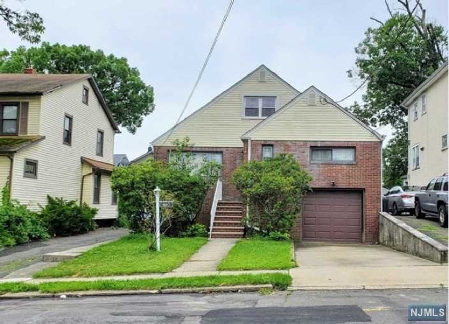 A spacious house on a premier piece of property in a quiet section of the town. Almost 2,200 SF living space with generously sized living room and elegant dining area (2 zone radiant floors), sleek, chef-worth modern kitchen with custom cabinets, granite counter tops and stainless appliances. All bedrooms are full sizes and a den is perfect for home office or guest room. The basement with a separated entrance is fully finished with a separated recreation room, a full bath and a summer kitchen ready. Harwood floors through out and central air conditioned and 5 years old roof and new water heater. The house sits on 2 family zone with good investment potential. Short walking to NYC bus stops and east access to major highways. Property has an oil tank, which will be removed shortly. Sold strictly as is. Sellers will not be doing credits or repairs. This nice and cozy home won't last!!!