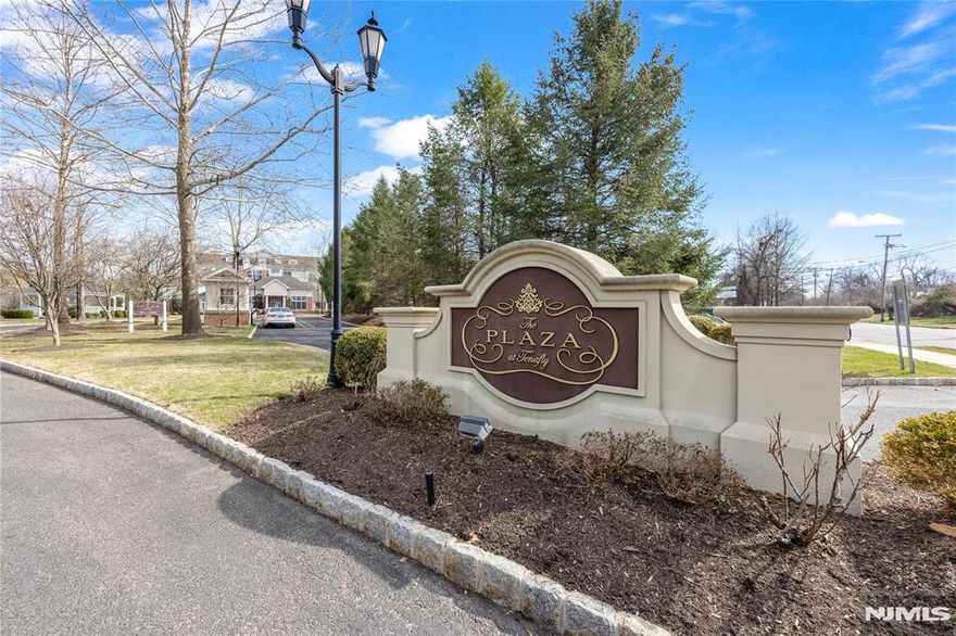Elegant country-club lifestyle condominium in Tenaflyâ€™s highly sought-after Blue-Ribbon School District. This fully gated community features a spectacular clubhouse with a grand salon and fireplace, state-of-the-art fitness center, media/theatre room with stadium seating, entertainment lounge with billiards tables, catering kitchen, business center, and full-time concierge service. This southeast corner penthouse residence offers 10-ft ceilings and expansive windows that fill the home with abundant natural light. The kitchen is appointed with premium appliances. One indoor parking space (#213) and one outdoor parking space (#107) are included. Additional special assessment: $673.90/month till April 2026.