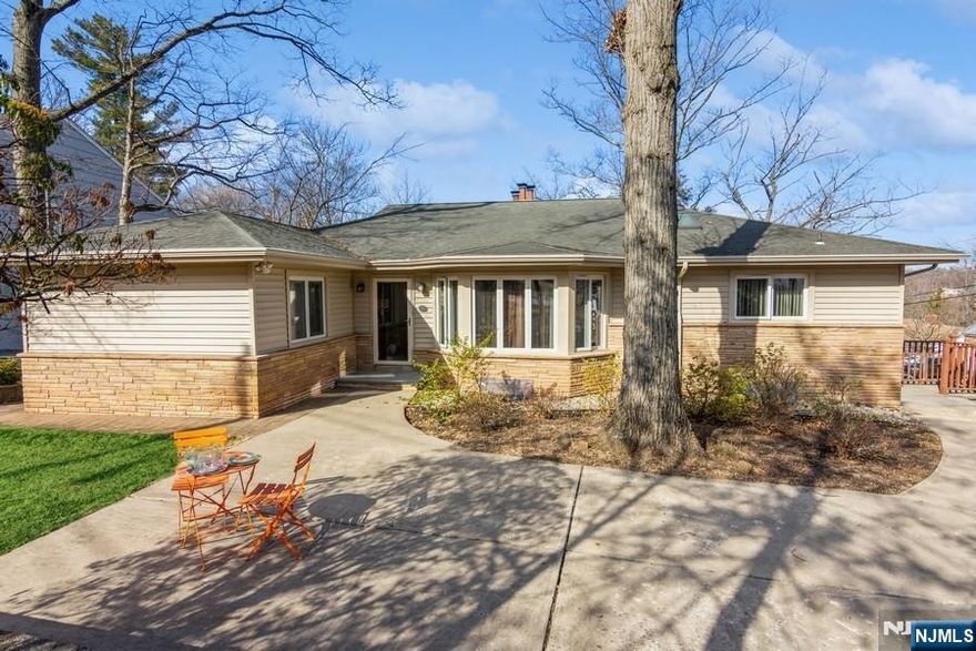 Must see this warm and inviting ranch offering 3+ bedrooms, living room, dining room, family room, three full baths, gorgeous eat-in gourmet kitchen, sunroom opening to expansive two level patio. Two car oversized attached garage. SS appliances and granite counters in kitchen, hardwood floor throughout and two fireplaces. Finished basement family room plus office and full bath could be used as in-law suite. Located in one of the best neighborhoods in West Orange. Great for commuters, Jitney # 3 to South Orange train station stops in front of the house. Renovated in 2018.