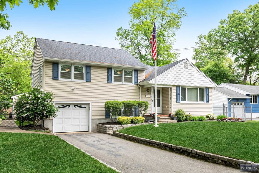 Great curb appeal! Move in ready! Meticulous split level home in tree-lined neighborhood! Welcome into an entry foyer that opens to large Living room with wood floors that is open to a beautifully updated Kitchen featuring a snack bar, gorgeous wood cabinets to the ceiling, recessed lights, Stainless Steel appliances and a large, separate dining area with walkout to rear deck. Three amply sized bedrooms all feature beautiful wood floors & ceiling fans. Ground level boasts a finished family room, powder room, garage entry & rear yard walkout. Large basement is just waiting to be finished. Fully fenced yard, with a great deck for entertaining and a large shed with electric! Two driveways for parking! Close to shopping, restaurants, Rts 287 & 208 and just a few miles from NYC express bus park & ride!