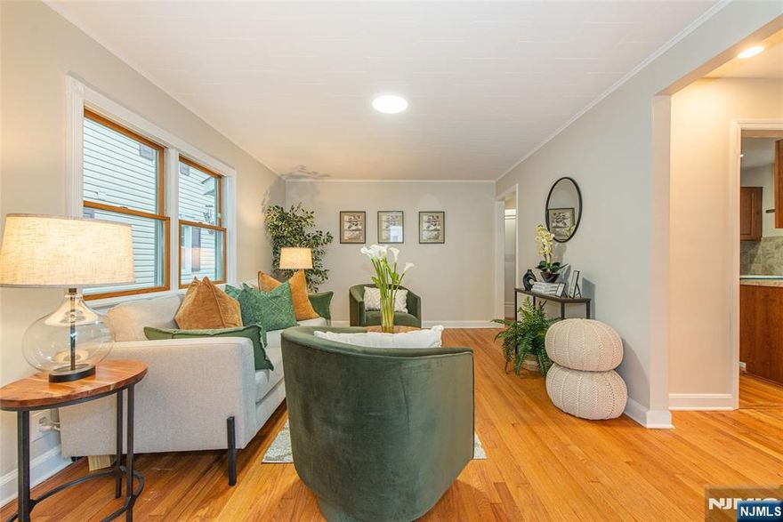 Charm, convenience, and income potential all meet at 7 Sayers Place in West Orange. This two-family home features gleaming hardwood floors throughout and energy efficient solar panels. The first floor offers two bedrooms, a living room, dining room, galley-style kitchen, and full bath. While the second floor offers two bedrooms, a living/dining room, eat-in kitchen, and full bath.The finished basement with its own separate entrance can serve as the perfect in-law suite or be combined with the first floor for a spacious duplex. It offers two additional bedrooms, a recreation room, and a full bath. Enjoy a private oversized backyard, off-street parking, and a prime location near Main Street cafes, eateries, and shops. Commuters will appreciate a NYC bound bus stop just blocks away, Midtown Direct train service on the Morris & Essex line, and the free West Orange jitney to nearby stations.