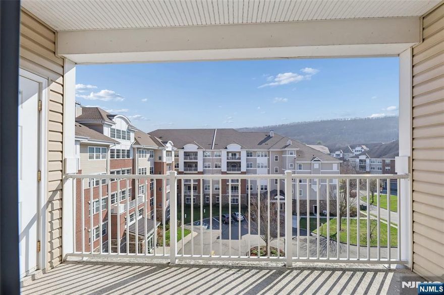 Enjoy resort-style living with luxury, comfort & convenience in this 55+ community with 24-hour gated security. DEEDED GARAGE under building with elevator right to your door. This spacious top-floor 2 bedroom, 2 bath residence offers thoughtful design & elegant living throughout. The bright kitchen provides ample space for a table & chairs. The large utility room offers abundant storage and convenient washer/dryer. French doors just off the formal DR open to a versatile den or cozy family room, home office, or guest space. The sliding glass doors in the LR lead to a covered balcony; the perfect spot to enjoy morning coffee or relax at day's end. The primary BR suite is a peaceful retreat, highlighted by a tray ceiling and a spacious WIC. The spa-inspired en-suite bath incl walk-in shower w/built-in seat, double vanity sinks, and private water closet. Wanaque Reserve features a wealth of amenities: clubhouse, fitness center, steam/sauna rooms, indoor/outdoor pools, arts/crafts studio, movie theater, library, walking & biking trails, bocce ball, tennis/pickleball courts, restaurant, card room, ballroom, billiards, and more. Don't let this opportunity pass you by. Experience the unrivaled lifestyle that this exceptional condominium has to offer. Move right in and start enjoying the lifestyle you deserve.