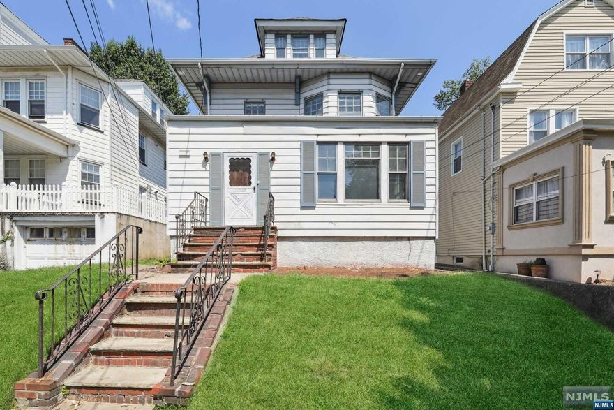 Check out this amazing opportunity to purchase this 5 bedroom, 2 full bath side hall colonial style home on a quiet tree lined street! The front door leads you to a large enclosed porch that invites you inside and opens up to a grand foyer w/ high ceilings & french doors to the huge living room. The living room is bright and sunny w/ lots of windows & pocket doors leading to the formal dining room which has a beautiful coffered ceiling & custom built window seating w/ storage. This lovely home features hard wood floors throughout w/ laundry room & full bathroom on first floor. The galley style eat-in kitchen has a spacious pantry w/ a back door leading to the deck & above ground pool which is great for entertaining. The second floor offers 3 bedrooms w/ a full bathroom & third floor has 2 more bedrooms w/ lots of closet/storage space. There is parking for 5 cars in driveway plus a two car garage. This home has approximately 2,000 square feet of living space.