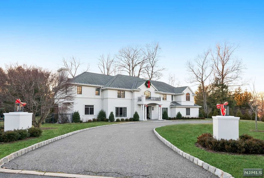 Located on a prime corner lot on approximately 1 acre, this impeccably maintained center-hall colonial estate is a true showstopper! Enter through the tastefully designed 2-story foyer featuring polished stone flooring with contrasting inlays and curved staircase elegantly finished with wrought iron and wood railings. The main level features a formal dining room leading directly into the spacious kitchen with center island, as well as three different living room areas. The second level is accessible from two separate stairways each located on opposite wings. At the top of each staircase you will find two spacious master bedroom suites each equipped with spa-like bathrooms and over-sized closets. In between these two master bedroom suites are 3 additional generously-sized bedrooms. The fully finished walk-out lower level is equipped with a gym, wet bar bedroom, full bathroom with sauna. The backyard features a heated Gunite swimming pool surrounded by a Kool Deck & a private cabana