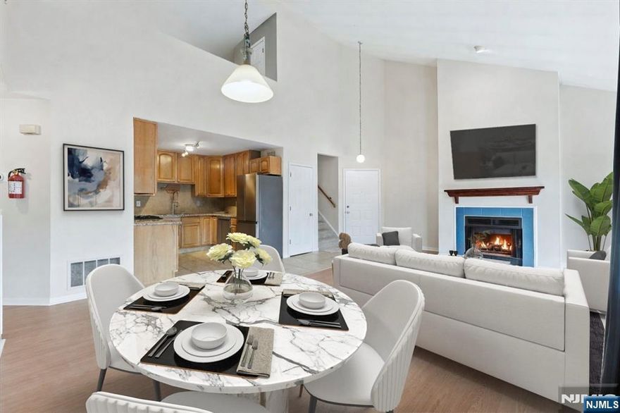 Great rental opportunity in Timber Valley, located in the vibrant town of Ramsey with excellent schools, shopping, dining, and convenient access to NYC transportation. This unit features a spacious living room and dining area with cathedral ceilings, brand new LVP flooring, and a fireplace. Sliding doors lead to a private deck with scenic views, perfect for relaxing. The updated kitchen offers granite countertops and stainless steel appliances. The primary bedroom includes a deep walk-in closet and access to a full hallway bath. The upper level features a nicely sized second bedroom and a large loft that can be used as a home office or third bedroom, complete with a skylight, full bath, and large closet. Additional features include in-unit laundry and an attached garage. Timber Valley offers amenities including a pool, clubhouse, and picnic area. Conveniently located near golf courses and parks with ample guest parking. A must-see rental opportunity.