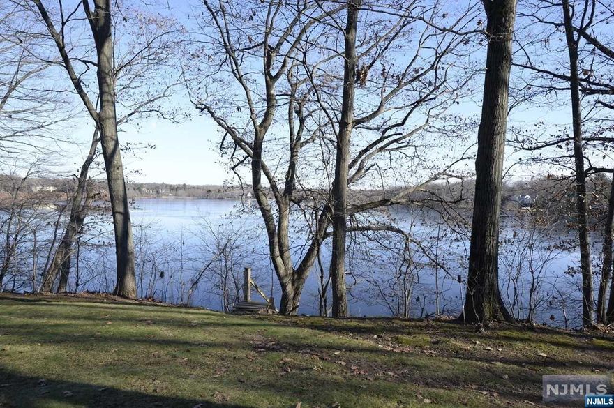 Once in a lifetime opportunity to own nearly 300 feet of lakefront property on sought-after Indian Trail Drive. Breathtaking, unobstructed views of Franklin Lake from this 5 bedroom, 4 bath ranch style home. Situated on 1.84 acres in desirable West Gate of Urban Farms, close to the Indian Trail Club, Franklin Lakes Nature Preserve and all that this wonderful community has to offer. A winding private driveway leads to this mid-century style ranch. Enter into a large gallery foyer opening to the formal living room with fireplace and dining room. The kitchen opens to both the courtyard and great room, overlooking the pool and lake, with incredible views. Enter in from the pool to a laundry/mud room, full bath, guest room or office. At the opposite end of the house are 3 bedrooms, 2 full baths and an inviting master suite overlooking the lake. Imagine waking up to that view! Live in the home or build your dream house. This is the one you've been waiting for. Sold AS IS.