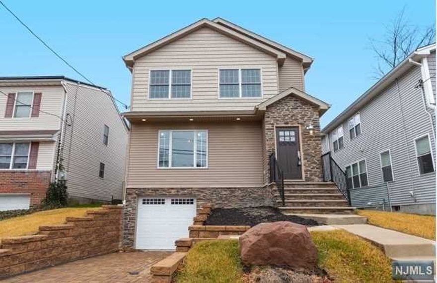 This home is 3 years young built on existing foundation. Beautifully constructed Colonial with approximately 3500 sq ft. of living space. First floor features an entry foyer, hardwood floors throughout, living room, eat-in kitchen with double appliances opening to an open concept dining room/great room with gas fireplace, and a powder room. Second floor features hardwood floors, 4 bedrooms, full bath, primary bedroom on suite and laundry Room. Basement is fully finished with Family/Rec Room, bedroom, office/gym and full bath. Close to transportation, houses of worship, shopping and parks.