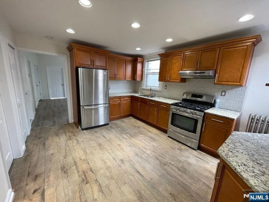 Beautifully Renovated 1st-Floor 3-Bedroom Apartment. Welcome home to this freshly renovated 1st-floor apartment featuring three nicely sized bedrooms, perfect for comfortable living. Enjoy an updated kitchen with modern finishes and an upgraded bathroom designed for convenience and style. Ideally located near mass transit, major highways, restaurants, schools, and shopping, this unit offers exceptional accessibility and everyday convenience. A great option for anyone seeking a spacious, modern living space in a prime location! No Pets