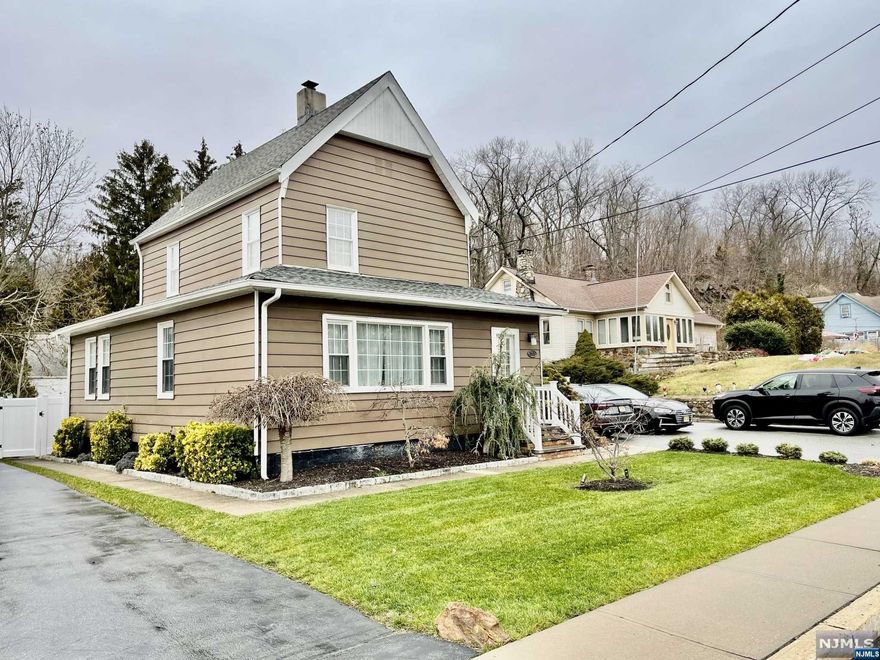 Amazing opportunity to own this 2 family home, in highly desirable Wanaque. First floor unit features a living room with gorgeous hardwood floors & a stunning (non-functional) fireplace. The kitchen, which is open to the dining area, is a great spot for for gathering and entertaining. The 2 bedrooms are off the kitchen, where you will find a beautifully renovated bathroom. Head downstairs to the basement where there is a laundry room & some storage. The second floor unit features a 1 bedroom with an updated kitchen & renovated bathroom. The backyard is the perfect place to grill and relax. Room for a pool or hot tub. Steps to NYC NJ transit bus stop, and hiking trails of Norvin Green State forest.