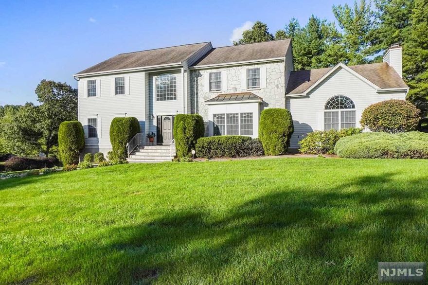 Step inside this meticulous 5 bedroom, 3.5 bath Col, renovated in 2017. Dramatic 2-story foyer accented by a magnificent alabaster chandelier greets you. Enjoy distinctive mill work & glistening hardwood flrs throughout. Relish entertaining guests in a banquet size dining room. Imagine meal preparation in the master chef's Kit. w/rich custom cabinetry, state of the art appliances & granite countertops. French doors lead from the kitchen into a 2-story Great Rm, w/crackling fplc. The sun filled cath. ceiling 3 season Rm, overlooks a magnificent paver patio & professionally landscaped yard. The spacious 1st floor BR w/ensuite bath is perfect for guests. Completing this level is a Lndry Rm w/lndry chute from the 2nd flr. Retire to a sumptuous primary suite accented with a tray ceiling & stunning updated tiled bath w/jacuzzi tub & separate shower. 3 BR & tiled bath complete this level. Enjoy a superb, fin. lower level w/abundance of storage. Top rated schools, conv. to NYC Transp