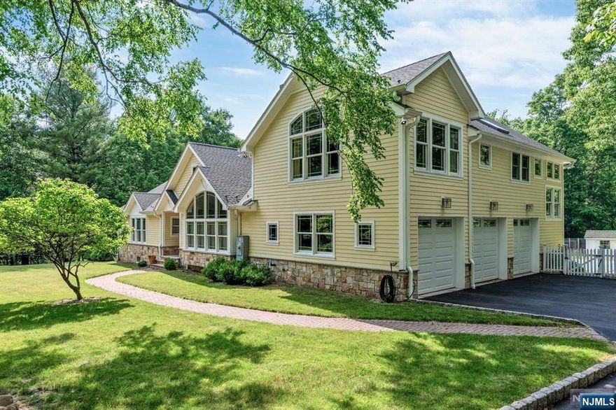 Discover pure luxury in this stunning, one-of-a-kind 5 Bedroom / 4.5 Bathroom Contemporary home situated on 2.5 acres on one of the best streets in highly sought after Upper Saddle River. This isn't just a home, it's a lifestyle that features only finest finishes. First floor includes entry foyer, living room w/fireplace, dining room, stunning Chef's kitchen w/ breakfast nook, three bedrooms, two full bathrooms, powder room, mudroom, and three car garage. Beautiful Chef's kitchen includes SS appliances, quartz countertops, custom cabinets, and two large center islands. Second floor features a resort-like master suite w/ custom walk-in closets, gorgeous ensuite bathroom, and sitting area. Partially finished basement includes bedroom, full bathroom, art room, workshop, and utilities/storage. Completing this lovely home is a serene backyard with in-ground pool, deck, garden, & even ducks and chickens! With award winning schools and the ultimate privacy, this is one not to be missed!