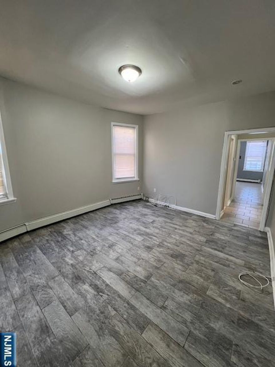 This peaceful block is conveniently located near transportation. The 3-bedroom unit features stainless steel appliances, and granite countertops, as well as updated windows and a renovated bathroom with fresh tile. It's just 5 minutes to Penn Station, 10 minutes to Jersey City, and 15 minutes to NYC, with a bus stop on the corner offering a direct route to Penn Station. You'll also be close to schools and some of the best restaurants in town