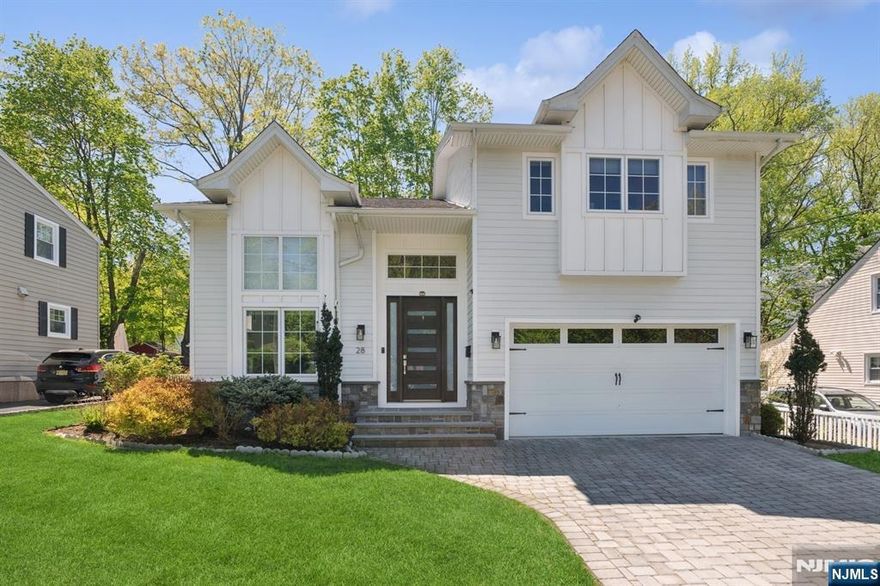 Built in 2019, this stunning Tenafly home sits on a beautiful street and features a double-height entry and soaring ceilings throughout the main floor. The open layout includes a spacious family room with fireplace and double-height ceilings, a sleek modern kitchen, dining room, mudroom, powder room, and 2-car garage. Upstairs, the primary suite offers a walk-in closet plus his & hers closets. Two childrenâ€™s bedrooms share a Jack & Jill bath, and a third ensuite bedroom completes the floor. The high-ceiling lower level features a bedroom, full bath, rec area, and generous storage. Beautiful property in a top-rated town with excellent schools. A must-see!