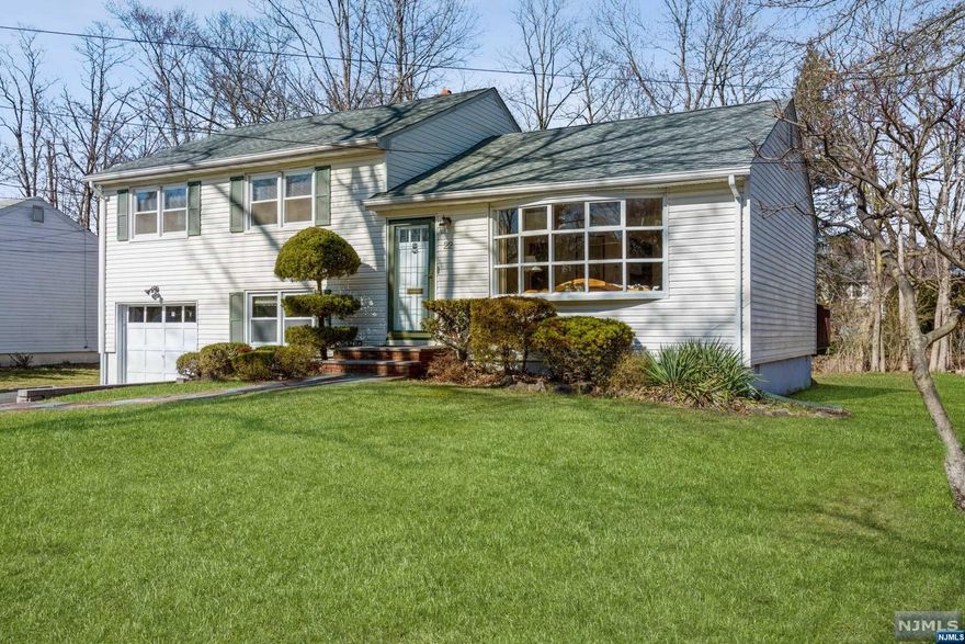 Sun filled south facing split. Pride of the ownership, immaculately maintained home, All hardwood floor, Living room with the bow window, formal dining room has slider to the deck, The kitchen is open to the DR with storage cabinets, counter spaces. Master with 1/2 bath, walk in closet, closet. two good size bedrooms with large closets. Full bath has shower over the tub. Ground floor familyroom with carpet. laundry room, utility room are off the FR, walk out to the patio. Roof,-9 years old, Hot water heater, HVC/ AC all within last 3 years. Recently freshly painted. you'll enjoy to visit this beautiful home.