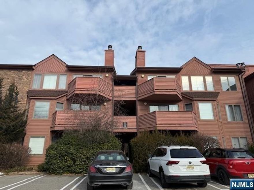 Lovely and spacious unit in prestigious Washington West complex. When entering this 2 bedroom, 2 bathroom units, you will see a very bright and large living room with a nice fireplace. As it faces South, plenty of sunshine comes in from the wood deck. Wood floors throughout, and the whole unit has just been freshly painted. All appliances are included, including the window treatment. There are plenty of closet spaces. One parking spot is right in front of the unit. This townhouse complex is only steps away from NY buses, shops restaurants, parks and schools. Do not miss this gem!