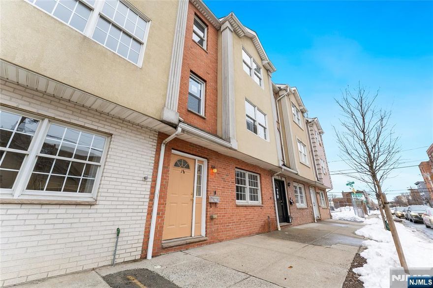 Welcome to this beautifully renovated, move-in ready 3-bed, 2.5-bath townhouse in the heart of Newark's Central Business District / Downtown an ideal blend of urban living and modern comfort with no HOA fees. Situated on a quiet street, this home offers privacy while being close to the city's dining, parks, and cultural destinations. The first level features a bedroom with flexible use for guests or a home office, along with direct access to the attached garage and rear entrance. The second level offers an open layout with kitchen, living, and dining areas, plus a convenient half bath. The third level includes two additional bedrooms, including a primary suite with a private full bath. Central air and heat provide year-round comfort. Located near Newark Penn Station, offering NJ TRANSIT and Amtrak service with travel to New York City in approximately in less than 25 minutes. The Prudential Center and other downtown amenities are just minutes away. A rare opportunity to own a well-appointed home in a prime downtown location with modern updates and versatile living spaces.