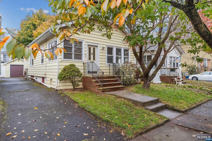 Welcome to this 2-bedroom, 1 bath Ranch nestled on a serene dead-end street perfect for first time homeowner or someone looking to downsize. A long driveway leads to the detached garage that offers ample space for parking and storage. Step inside to the enclosed porch which could be an office or playroom. New carpet in dining room and spacious living room. Hardwood floors in kitchen and two bedrooms. Freshly painted. Full unfinished basement. Newer deck freshly painted perfect for enjoying the outdoors. Conveniently located close to transportation.