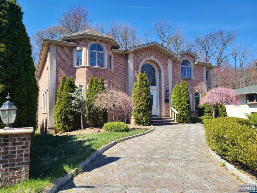 This magnificent home is an all brick center hall colonial built in 2007 with a circular driveway and great curb appeal. It has a 3 car heated attached garage. The tranquil backyard borders the Flat Rock Park, a nature reserve, which guarantees much privacy. The two story entryway leads into a heated foyer and and elegant curved staircase. The main level consists of a large formal living room, a spacious dining room, a great room w/fireplace, a gourmet eat-in kitchen w/ center island, high-end appliances, a butler's pantry, an office, a full bath, and a half bath. The 2nd level offers a master bedroom with an en suite and 2 additional bedrooms w/ a Jack & Jill bath. The basement is fully finished with recreation spaces, a bedroom, a full bath, and laundry. This dream home is conveniently located minutes from New York City and has low property tax.