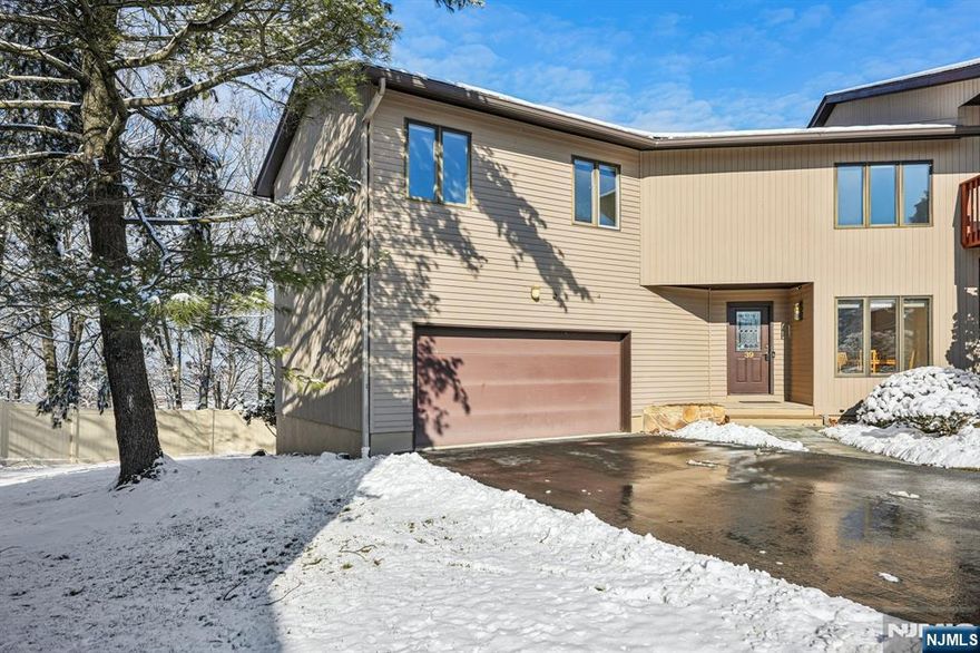 CALL EVE WITH ANY QUESTIONS 973-632-4063 Welcome home to this beautiful and sunlit townhouse end unit . One of the largest units in Wedgewood Knolls Complex. Featuring 3 bedrooms, 2 full baths, 1 half bath, hardwood floors, and new carpeting in bedrooms. Freshly painted and move in ready. 2 car garage and ample parking in driveway as well. The main floor features eat-in kitchen, Dining room, powder room, large living room with custom hand sculpted fireplace, and sliders to deck. The second floor features a very large primary bedroom with full bath and "make-up" area with sink separate from bathroom. Plenty of closet space, main bath, 2 large bedrooms and balcony overlooking first floor. Easy commute to NYC and close to all major highways.