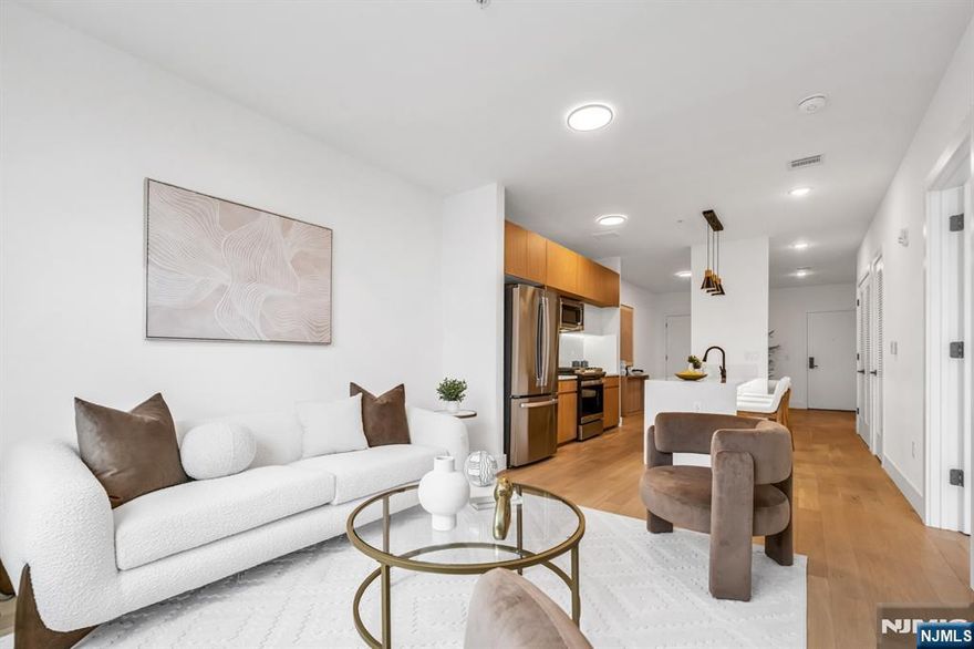 SELLER PAID CLOSING COSTS- LIMITED TIME OFFER. PENTHOUSE UNIT- Introducing Tailor House Union City, Hudson Countyâ€™s newest boutique luxury condominium. This intimate elevator building offers just 48 thoughtfully designed residences, combining privacy, sophistication, and urban convenienceâ€”all just 15 minutes from NYC by bus. Tailor House redefines modern living with oversized 1- and 2-bedroom homes featuring open-concept layouts, soaring 9â€“10 ft ceilings, and generously sized bedrooms. Sleek kitchens are outfitted with waterfall quartz countertops, European-style two-tone oak cabinetry, GE Professional Series appliances, and select units include contemporary islands. Bathrooms evoke a spa-like feel with floor-to-ceiling porcelain tile, glass-enclosed showers, and marble-topped vanities. Residents enjoy upscale amenities including a fully equipped fitness center, stylish lobby, landscaped garden terrace, and smart security with Swiftlane intercoms. Assigned parking is included, with additional spaces available for purchase, and a 5-year tax abatement adds even more value. Nestled in the heart of historic Union City, Tailor House offers a refined lifestyle where modern design meets everyday convenience.